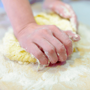 Kneading dough on a counter